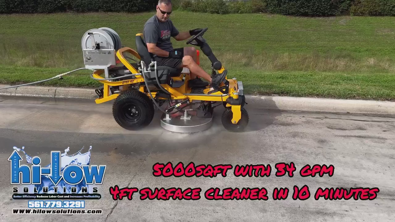 Technician operating an industrial riding surface cleaner in a sun-drenched commercial plaza.